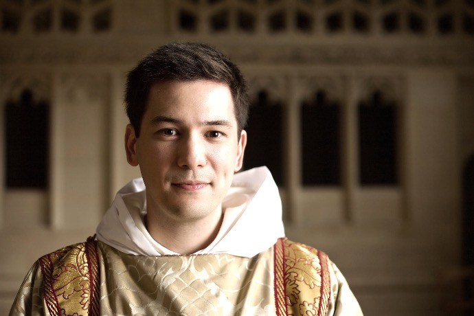 man in white and gold traditional dress